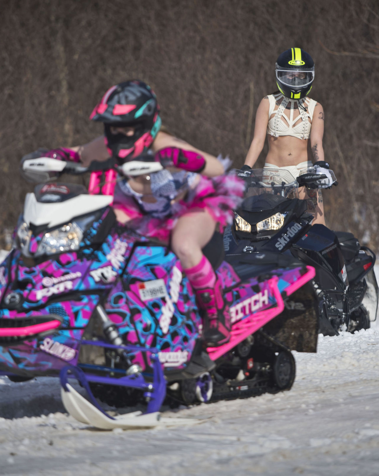 Bikini-clad snowmobilers rally again to fight breast cancer